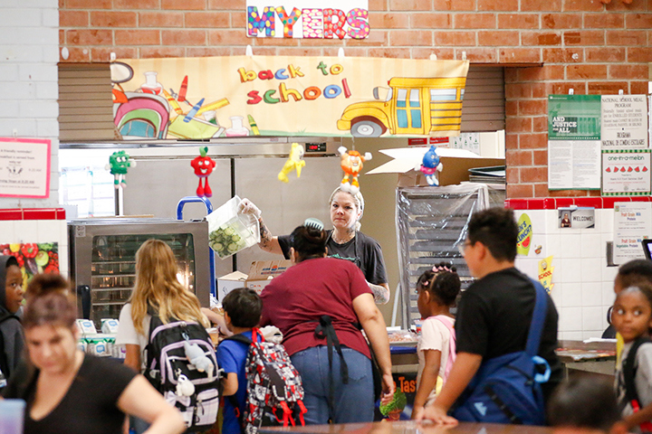 Students stand in line in the cafeteria